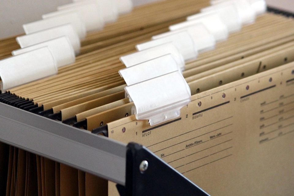 Hanging folders with blank tabs in a drawer